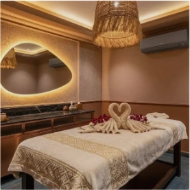 Warm therapeutic massage room at Spa Palm Amore Khar West